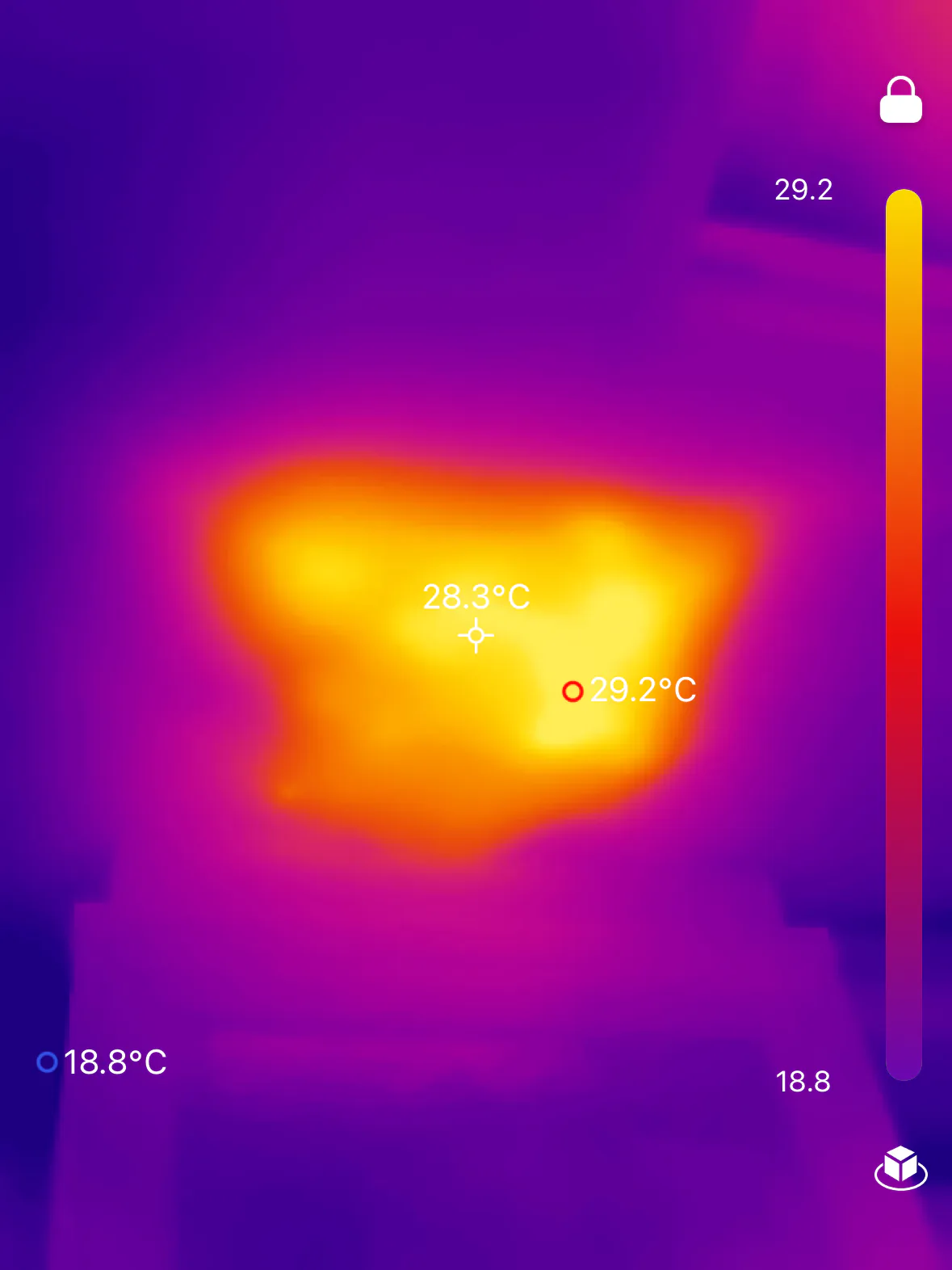 Thermal-camera display showing a warm area against a cooler background