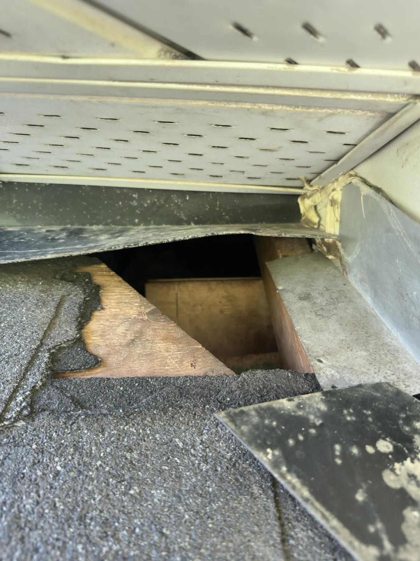 Rectangular opening cut into a low-slope roof deck